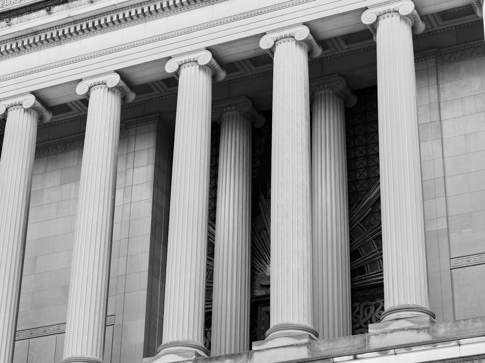Classical stone columns on a bank building, in black and white
